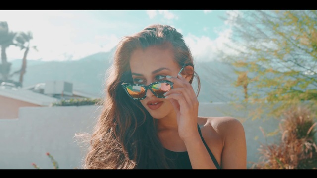 Video Reference N2: Eyewear, Hair, Sunglasses, Beauty, Lip, Glasses, Nose, Cool, Summer, Photography, Person, Outdoor, Woman, Cellphone, Phone, Talking, Water, Sitting, Looking, Holding, Front, Young, Standing, Wearing, Smiling, Green, Man, Girl, White, Pink, Beach, Goggles, Human face, Face, Selfie, Spectacles