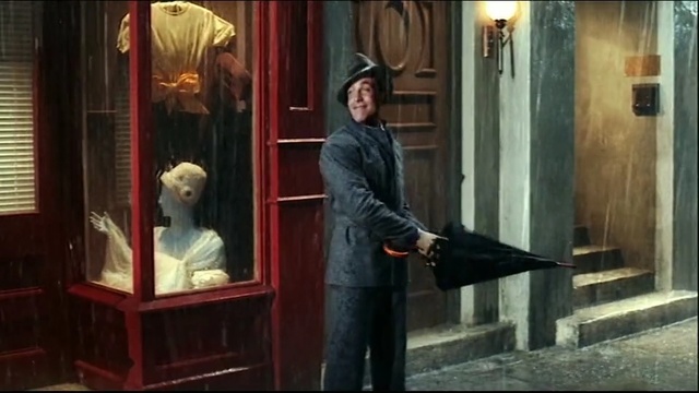 Video Reference N7: man, rain, hat, umbrella, smile, street
