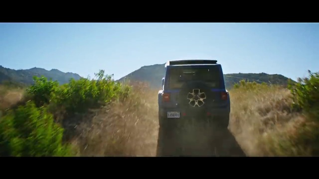 Video Reference N7: Off-roading, Vehicle, Screenshot, Rural area, Off-road vehicle, Dirt road, Photography, Landscape, Road, Off-road racing, Outdoor, Train, Grass, Traveling, Driving, Track, Photo, Highway, Coming, Green, Forest, Mountain, Field, Grassy, Bus, Riding, Sky, Land vehicle, Jeep, Way, Text, Auto part, Scene, Car, Wheel, Tree