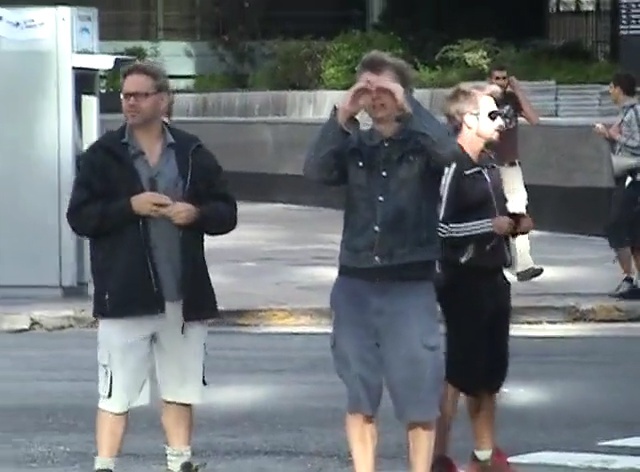 Video Reference N3: footwear, road, public space, infrastructure, street, mode of transport, pedestrian, snapshot, asphalt, vehicle, Person