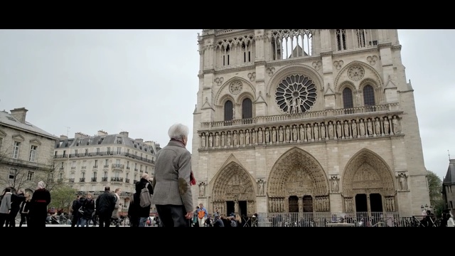 Video Reference N6: landmark, building, medieval architecture, sky, cathedral, historic site, place of worship, tourist attraction, history, classical architecture, Person