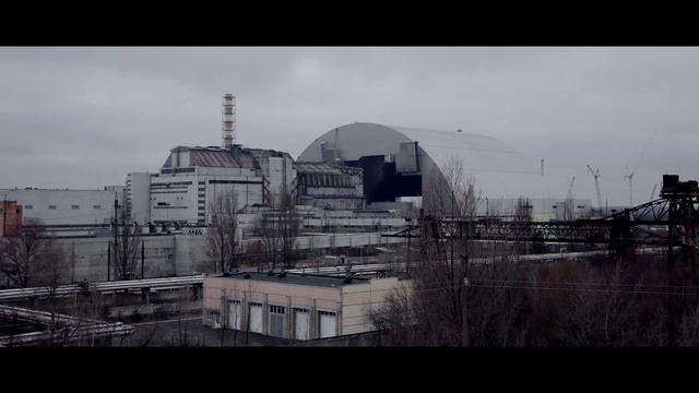 Video Reference N3: Urban area, Sky, Architecture, City, Building, Photography, Black-and-white, World, Industry, Outdoor, Train, Track, Grass, Photo, Railroad, Traveling, Bridge, Rail, Yard, Large, Long, Engine, Riding, White, Cloudy, Road, Field, Station, Street, Traffic, Man, Tall, Tower, Cloud, House, Window, Skyscraper