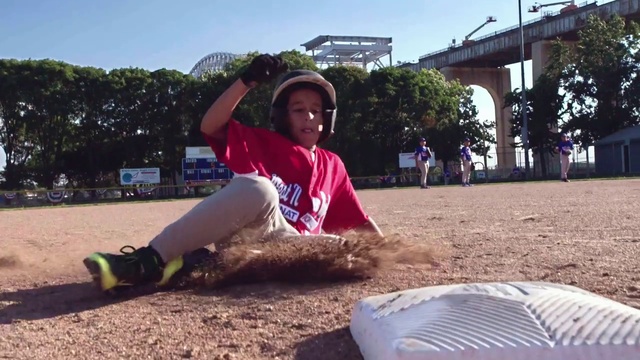 Video Reference N10: Public space, Fun, Leg, Grass, Leisure, Sitting, Play, Competition event, Playground, Sportswear, Person