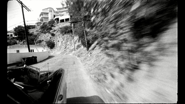 Video Reference N1: white, black, photograph, black and white, monochrome photography, car, photography, tree, sky, snapshot, Person