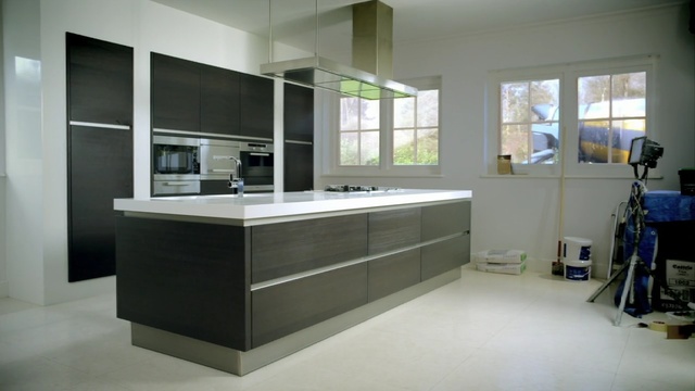 Video Reference N0: countertop, kitchen, room, cabinetry, interior design, sink, Person