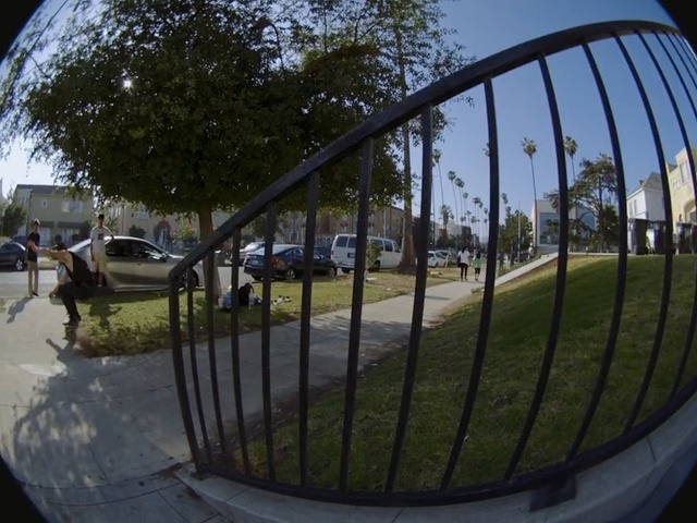 Video Reference N23: Reflection, Green, Fisheye lens, Photography, Iron, Grass, Sky, Tree, Metal, Architecture, Person, Fence, Outdoor, Building, View, Table, Street, Side, Sitting, Area, Park, Wooden, Large, Field, Mirror, Bridge, Riding, River, Standing, White, Man, Game, Car, Vehicle, Land vehicle, Wheel, Playground