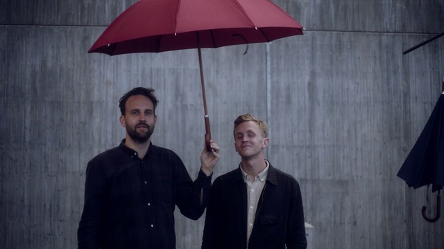 Video Reference N9: Umbrella, Red, Lighting, Gentleman, Fashion accessory, Suit, Light fixture, Formal wear, Lighting accessory
