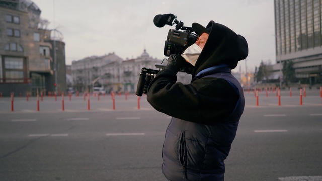 Video Reference N1: Snapshot, Camera operator, Photography, Street, Headgear, City, Road
