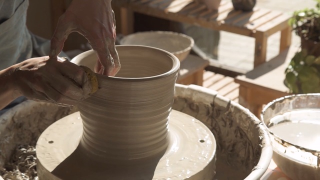Video Reference N4: potter's wheel, tableware, pottery, ceramic, material, table, Person