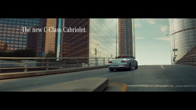Video Reference N1: car, land vehicle, road, urban area, mode of transport, infrastructure, metropolitan area, screenshot, skyscraper, vehicle, Person
