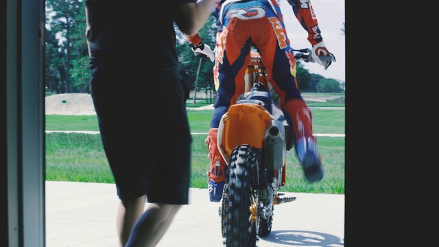 Video Reference N2: car, vehicle, racing, personal protective equipment, motorcycle, motorsport, race, helmet, stunt performer, sports equipment, Person