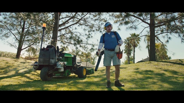 Video Reference N1: Lawn, Grass, Mower, Lawn mower, Tree, Vehicle, Outdoor power equipment, Leaf, Woody plant, Plant