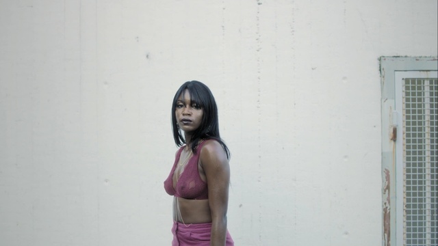 Video Reference N5: Face, Pink, Wall, Beauty, Skin, Shoulder, Arm, Joint, Black hair, Photography, Person