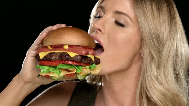 Video Reference N0: fast food, hamburger, junk food, food, sandwich, eating, mouth, cheeseburger, whopper, finger food, eating