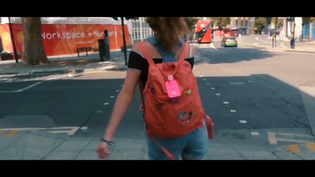 Video Reference N2: red, clothing, day, mode of transport, public space, girl, fun, snapshot, pedestrian, street