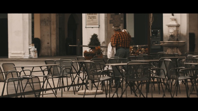 Video Reference N1: furniture, table, chair, darkness, screenshot, Person