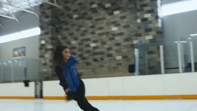 Video Reference N1: blue, ice skating, ice rink, winter sport, skating, ice, recreation, fun, winter, building, Person