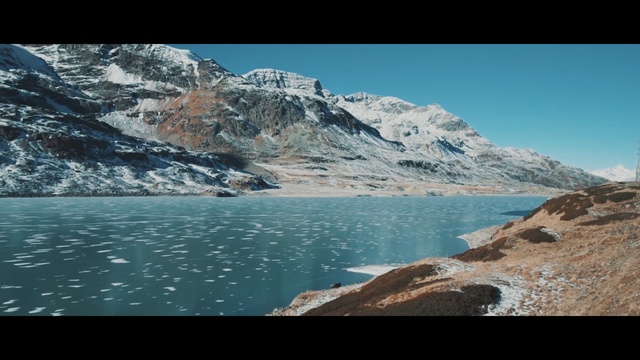 Video Reference N4: wilderness, lake, sky, glacial lake, mountain, water, mountain range, fjord, glacial landform, reservoir