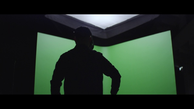Video Reference N6: Green, Black, Shadow, Standing, Darkness, Photography, Font, Human, Screenshot, Backlighting