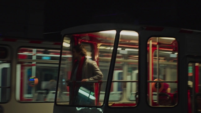 Video Reference N7: Red, Transport, Reflection, Snapshot, Mode of transport, Night, Public transport, Window, Metropolitan area, Architecture