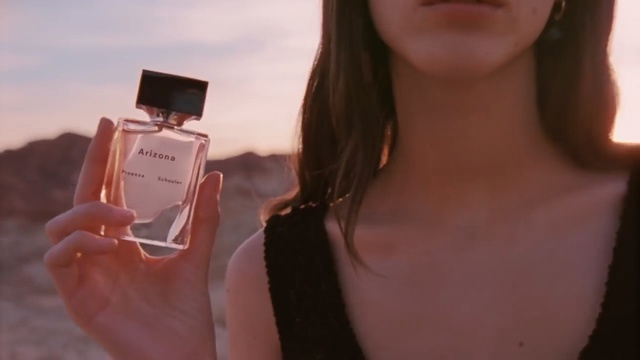 Video Reference N2: Perfume, Skin, Beauty, Lip, Pink, Neck, Cosmetics, Blond, Gadget, Technology