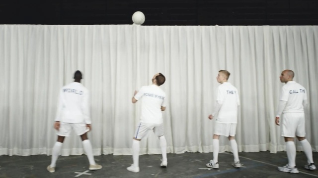 Video Reference N3: white, team, male, standing, uniform, outerwear, material, product, competition event, sportswear, Person