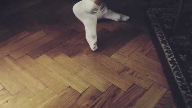 Video Reference N2: Floor, Wood flooring, Hardwood, Flooring, Wood, Laminate flooring, Leg, Wood stain, Hand, Room, Building, Indoor, Table, Wooden, Board, White, Woman, Man, Holding, Young, Cat, Cutting, Standing, Feet, Footwear