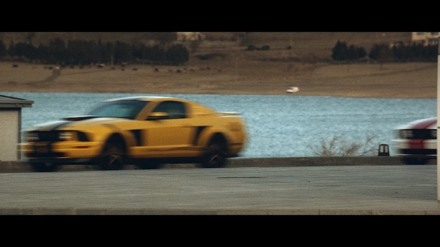 Video Reference N3: car, yellow, automotive design, mode of transport, performance car, race track, auto racing, vehicle, racing, sports car