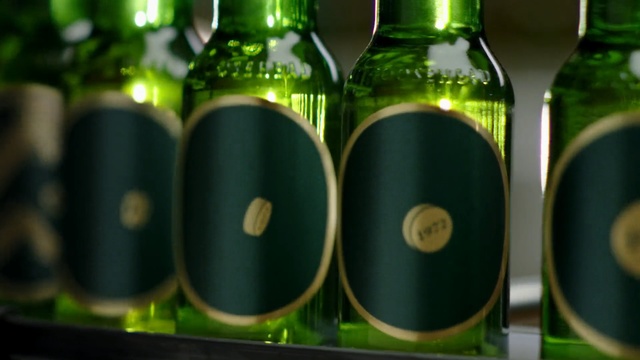 Video Reference N8: Bottle, Glass bottle, Green, Wine bottle, Drink, Beer bottle, Alcoholic beverage, Drinkware, Alcohol, Liqueur, Person