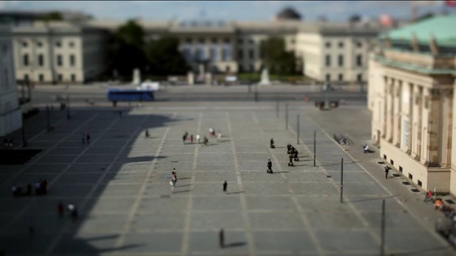 Video Reference N3: plaza, town square, city, sky, roof, building, facade, Person