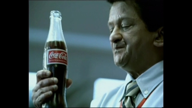Video Reference N2: drink, cola, bottle, alcohol, soft drink, carbonated soft drinks, coca cola, glass bottle, beer bottle, Person