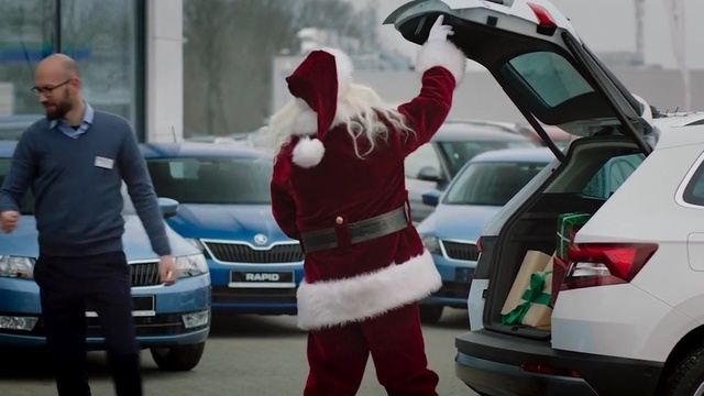 Video Reference N2: Santa claus, Vehicle, Car, Motor vehicle, Mode of transport, Snapshot, Fictional character, Vehicle door, Automotive exterior, Mid-size car