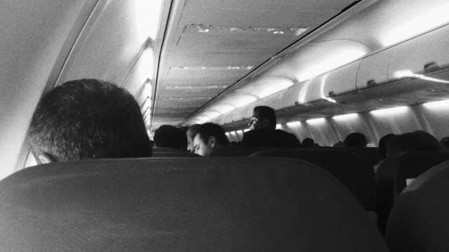 Video Reference N1: White, Air travel, Black, Aircraft cabin, Airline, Black-and-white, Monochrome, Photography, Monochrome photography, Aerospace engineering