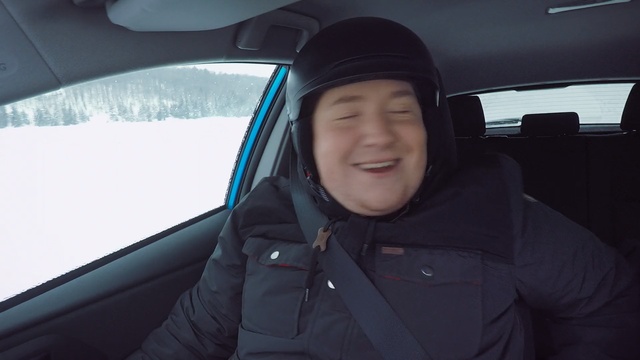 Video Reference N6: car, motor vehicle, vehicle, family car, automotive design, driving, photography, smile, automotive exterior, city car, Person