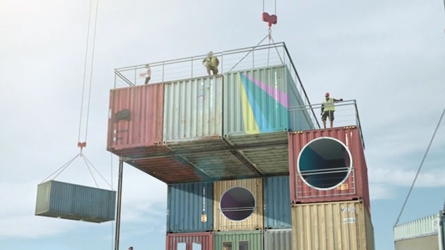 Video Reference N2: shipping container, facade, building, roof, Person