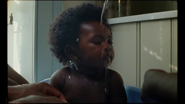 Video Reference N2: Hair, Face, Black, Hairstyle, Eyebrow, Head, Dreadlocks, Nose, Forehead, Black hair