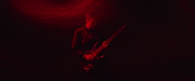 Video Reference N9: Red, Black, Darkness, Maroon, Light, Performance, Room, Photography, Musician, Guitarist