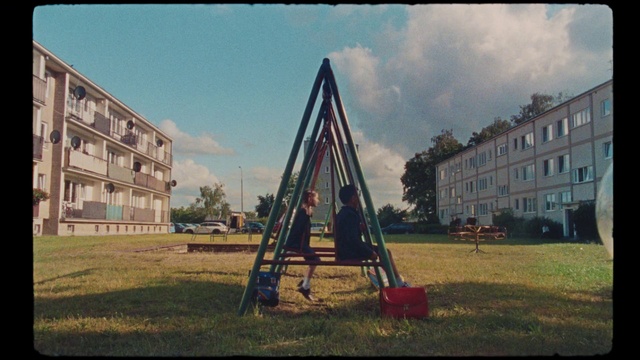 Video Reference N1: Playground, Public space, Tree, Sky, Urban area, Grass, Pole, Outdoor play equipment, Land lot, Suburb