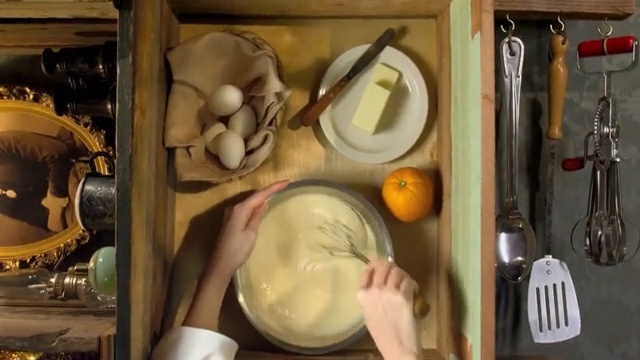 Video Reference N2: cooking, hand, top shot, eggs, egg, plate, orange, butter
