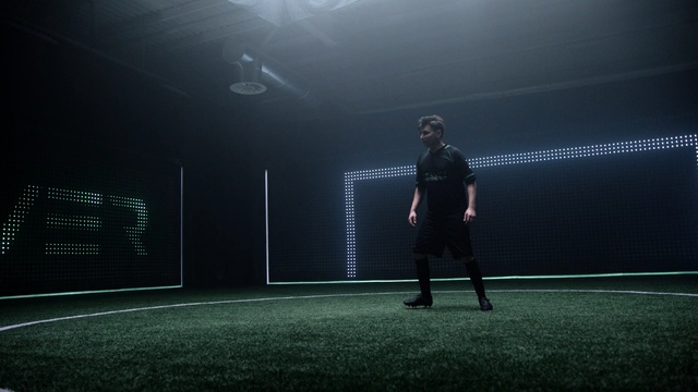Video Reference N5: black, atmosphere, light, darkness, photography, standing, sky, lighting, player, sport venue, Person