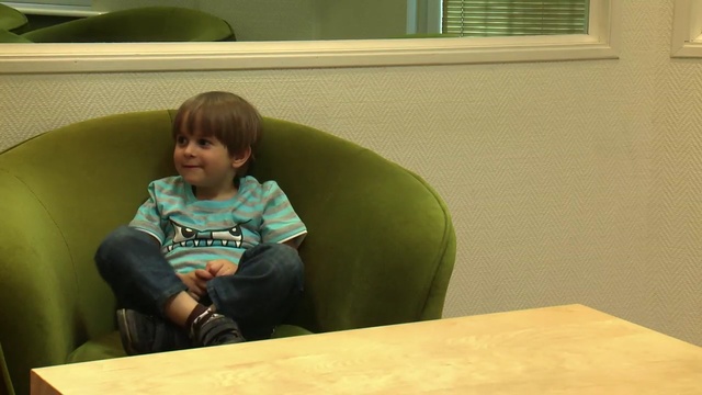 Video Reference N1: Child, Toddler, Sitting, Table, Room, Furniture, Person