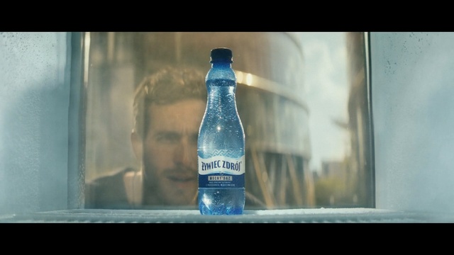 Video Reference N0: Bottle, Water, Glass bottle, Blue, Drink, Bottled water, Snapshot, Glass, Drinking water, Liquid, Indoor, Beverage, Sitting, Food, Photo, Small, Table, Open, Surface, Close, Orange, Clear, Vase, Cat, Laying, Text, Soft drink, Plastic bottle, Beer, Water bottle, Mineral water