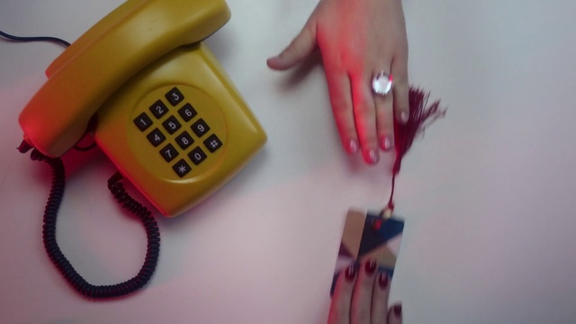 Video Reference N0: Finger, Pink, Yellow, Nail, Hand, Corded phone, Telephone, Electronic device, Thumb