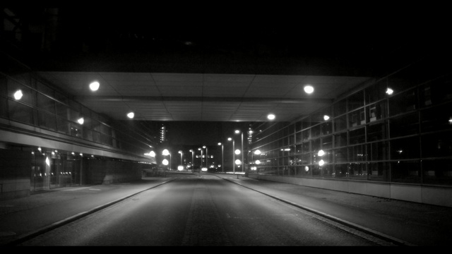 Video Reference N0: metropolitan area, black, night, lane, black and white, atmosphere, infrastructure, darkness, light, highway