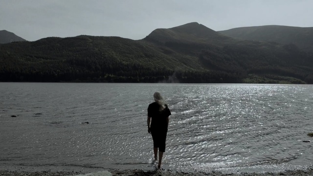 Video Reference N3: Body of water, Lake, Lake district, Loch, Shore, Sea, Standing, Water, Coast, Sound, Person