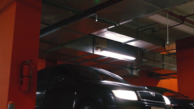 Video Reference N5: Vehicle, Car, Parking, Light, Automotive design, Automotive lighting, Parking lot, Automotive exterior, Headlamp, Wheel