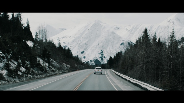 Video Reference N1: road, mountainous landforms, highway, nature, sky, tree, mountain, woody plant, snow, winter