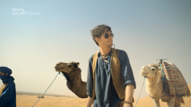 Video Reference N0: camel, camel like mammal, arabian camel, sahara, desert, landscape, aeolian landform, sky, livestock, tourism, Person