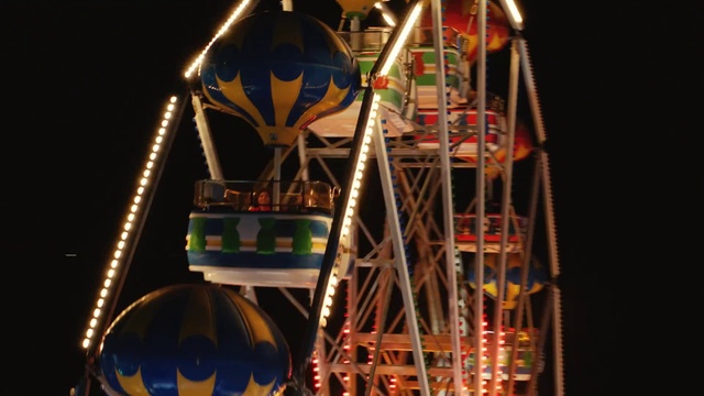 Video Reference N6: Ferris wheel, Amusement ride, Amusement park, Landmark, Tourist attraction, Fair, Recreation, Fun, Night, Festival