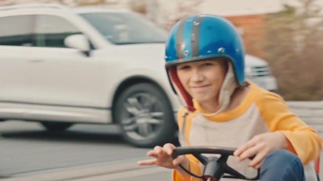 Video Reference N8: Helmet, Personal protective equipment, Vehicle, Child, Motorcycle helmet, Bicycle helmet, Headgear, Bicycles--Equipment and supplies, Car, Recreation, Person